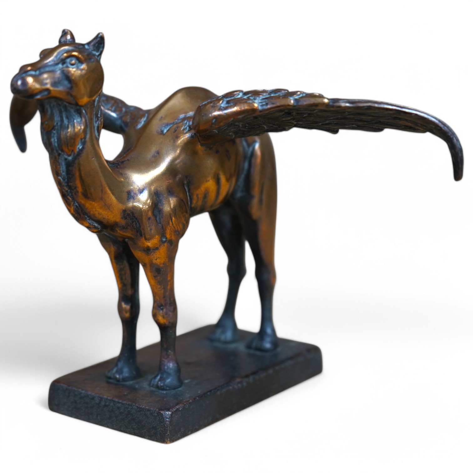 A bronze Royal Air Force 45th Squadron winged camel desk ornament, stamped Reg.746774 to the base